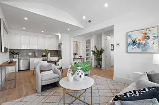 Santa Clara, CA home staging: Bright, modern living room with white walls, light wood floors, and stylish furniture.