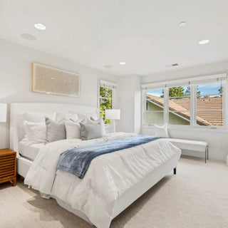 Santa Clara, CA Home Staging: Bright bedroom with white bedding, blue throw, and natural light