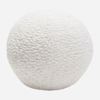 A 10-inch round white faux sheepskin accent pillow.