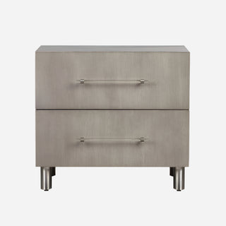 A Misty Grey Oak finish nightstand with two drawers, featuring acrylic and brushed stainless steel pulls, and brushed stainless steel legs.