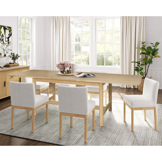 A beige Bloomfield dining table with a butterfly extension, made of wood, with rounded corners and tubular -full set .