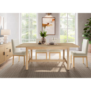 A beige Bloomfield dining table with a butterfly extension, made of wood, with rounded corners and tubular legs set.