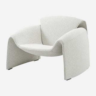 A beige fabric accent arm chair with a geometric shape, fully upholstered in a Boucle-like fabric.