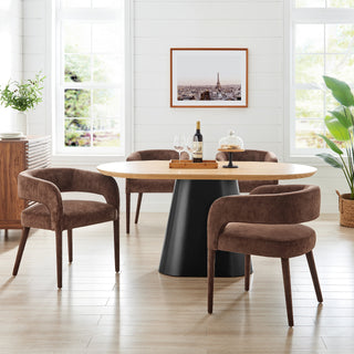 A brown velvet dining chair with a sleek- modern-design and wooden legs.