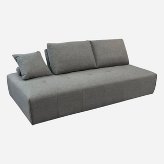 A gray fabric-covered cloud lounge seating platform with movable backrests and an accent lumbar pillow.