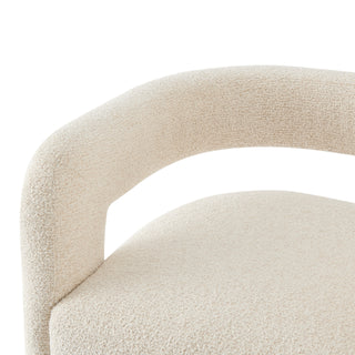 A gray fabric-dining side chair with a cantilevered base and a semicircular backrest.  left site arm's and body  handle