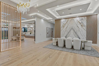 Modern interior with a dining area and marble wall