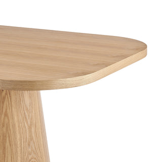 A rectangular dining table with a natural wood finish and two cylindrical pedestal bases corner site