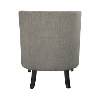 A textured taupe fabric upholstered accent chair with high-polish nailhead trim, a button-tufted back, and black wood legs left site back part.