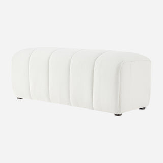 A white faux shearling bench with a channeled pattern and high-density foam padding.