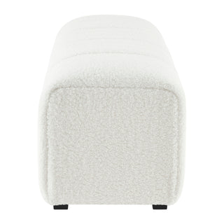 A white faux shearling bench with a channeled pattern and high-density foam padding left site   .
