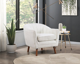 A white upholstered accent chair with channel-tufted backrest, brown-finished solid wood legs, and a removable seat-cushion Combination.