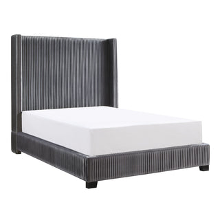 An Eastern King bed with a gray upholstered headboard, footboard, and rails with a white mattress on top.