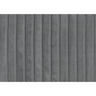 An Eastern King bed with a gray upholstered headboard, footboard, and rails with a white mattress on top.