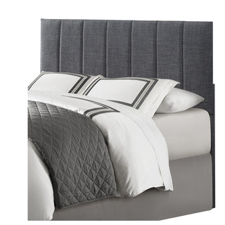 An Eastern King bed with a gray upholstered headboard, footboard, and rails with a white mattress on top with sites  on corner .