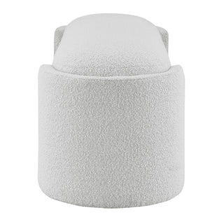 An oval-shaped fabric bench with a smooth, soft texture in a light color, likely white or light gray Left Site.