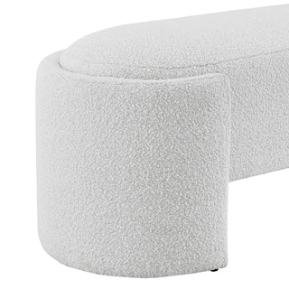 An oval-shaped fabric bench with a smooth, soft texture in a light color, likely white or light gray  Right Site.