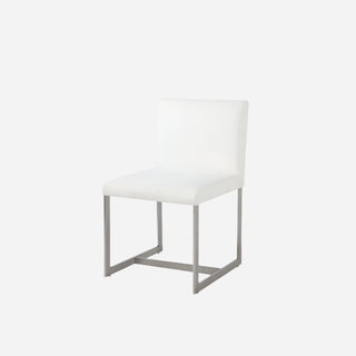 An upholstered dining chair with a pearl white fabric seat and brushed stainless steel legs.