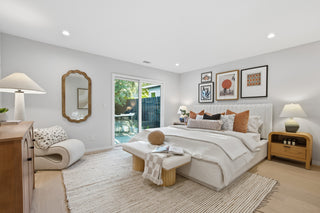 Modern bedroom with a bed, side tables, and decor