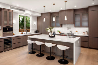 Modern kitchen with white island, wooden cabinets, and stainless steel appliances nice light wnd windows-1