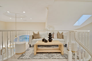 Modern living room with a staircase in the background