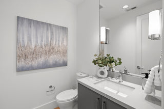 latest Modern bathroom with white fixtures, a sink, mirror, and decorative elements.
