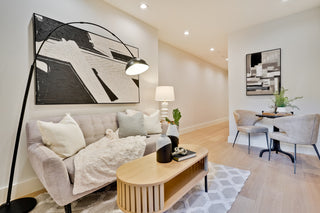 Modern living room with a sofa, coffee table, and decorative elements with blend light lamp