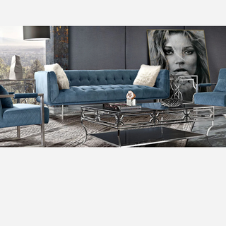 Luxury Contemporary Living Room with Blue Velvet Sofa and Mirrored Coffee Table
