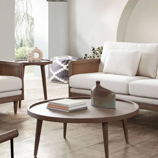 Mid-Century Inspired Living Room with Wooden Coffee Table and Neutral Seating
