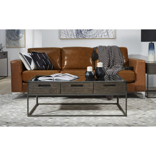 Modern Industrial Living Room Setup – Tan Leather Sofa with Wood and Metal Coffee Table
