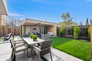 Backyard with outdoor furniture and a covered area