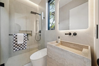 Modern bathroom with shower, sink, and mirror andi shower