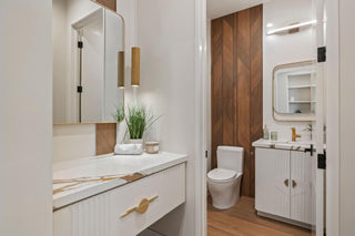 Modern bathroom with white vanity, toilet, and cabinets nice looking desing and view