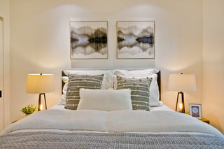 Modern_bedroom_in_with_a_bed_nightstands_and_abstract_art_on_the