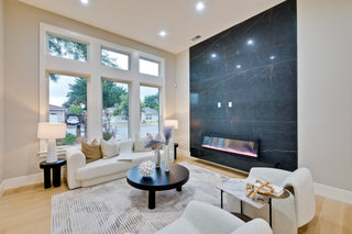 Modern bedroom with a bed, nightstands, and abstract art on the wall.