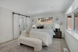 Modern bedroom with a bed, nightstands, and decorative elements , white looking