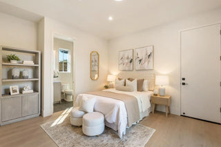 Modern bedroom with a bed, side tables, and decor with shalvs