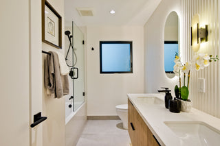 Modern_bedroom_with_is_a_bed_nightstands_and_abstract_art_on_the