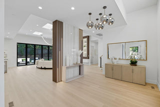 Modern bathroom interior with wooden vanity, mirrors, and decorative elements.
