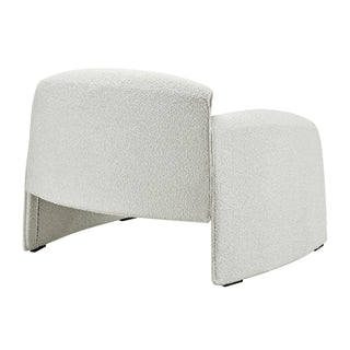 Modern cream textured accent chair with curved design.