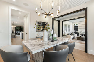 Modern dining room with marble table and gray chairs