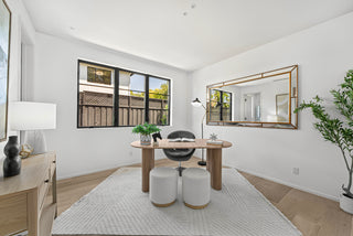 Modern home office with wooden desk, chairs, and decorative elements with nice looking room