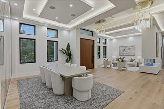 Modern living room with dining area in a stylish home interior.