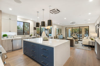 Modern kitchen with a large island and open-plan living area