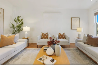Modern_living-room-with-white_sofas_coffee_tablvce_and_decorative_items.