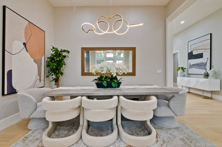 Modern living room with a large window, stylish furniture, and decorative elements.