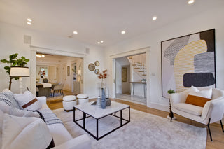 Modern living room with a unique dining table design and decorative elements.