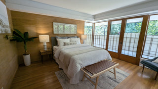 Modern living room with brown leather furniture and abstract art non that