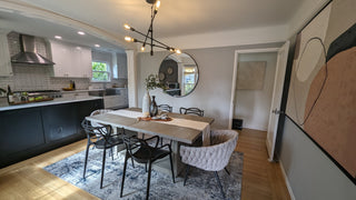 Modern living room with brown leather furniture and abstract art non that wallness.