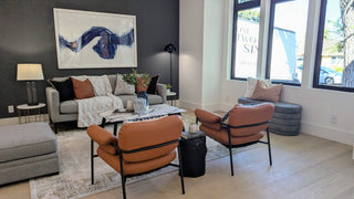 Modern living room with brown leather furniture and abstract arts non .